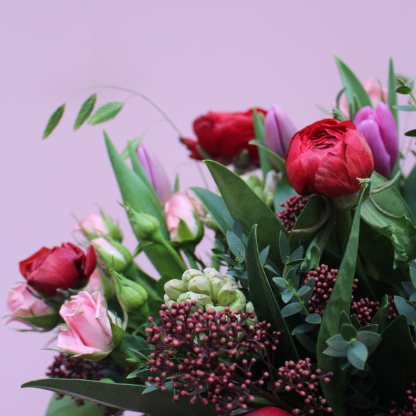 Pretty Woman (Spring is in the air with this bunch in reds, pinks and purples including roses, ranunculus, hyacinths and tulips)