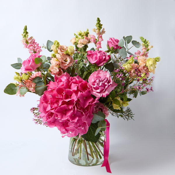 Pretty In Pink (A super pretty bouquet in all pinks including snapdragon,  lisianthus, hydrangea, roses and waxflower)