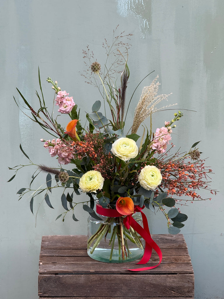 Gone With the Wind (A whimsical beauty containing ranunculus, scented stocks, genista, calla lily and a variety of grasses)
