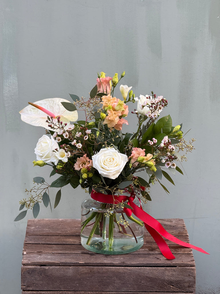 Breakfast at Tiffany's (A classic combination roses, freesia, lisianthus, waxflower and anthurium in whites and pale pinks)