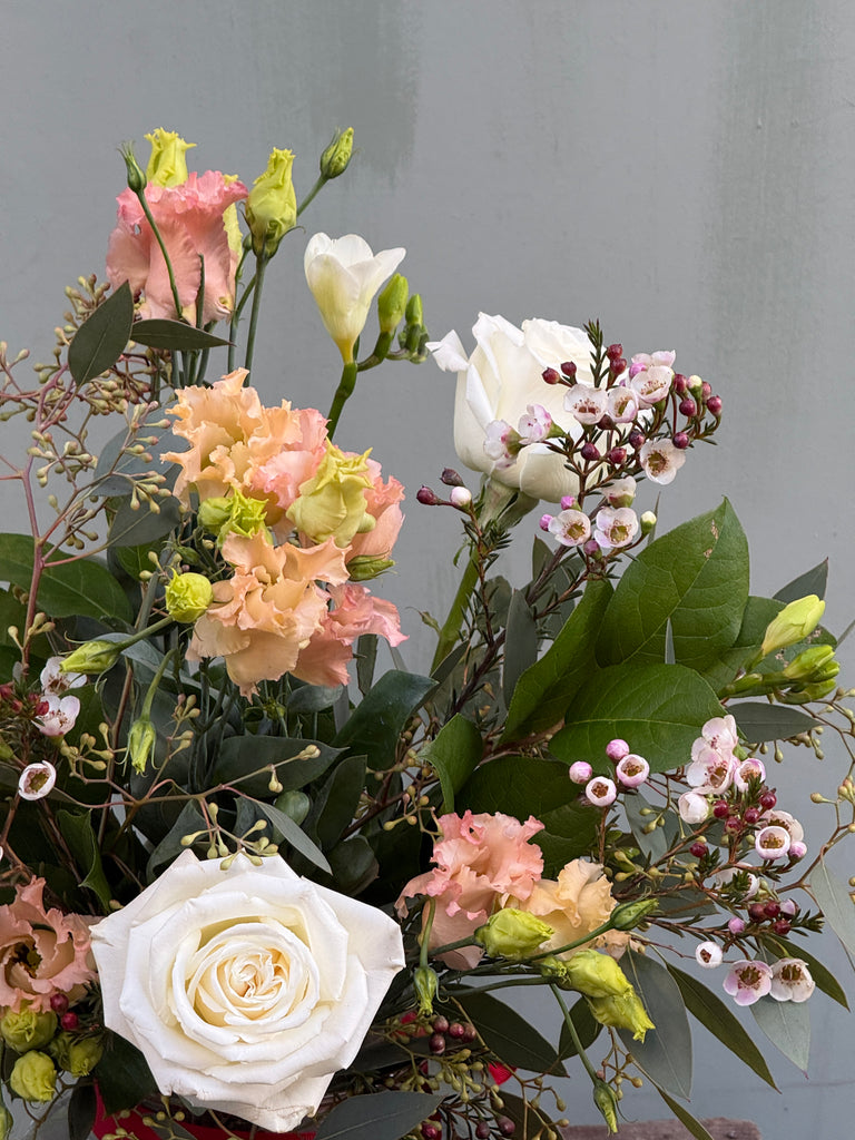 Breakfast at Tiffany's (A classic combination roses, freesia, lisianthus, waxflower and anthurium in whites and pale pinks)