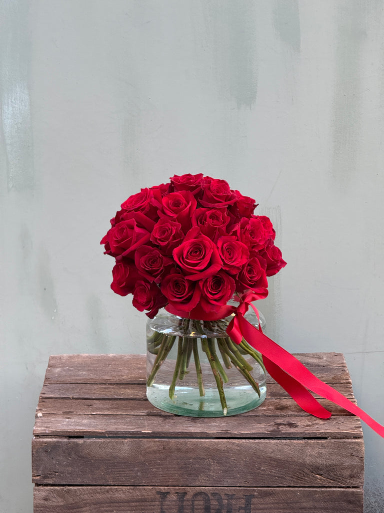 About Time (Luxurious and elegant - this head to head red rose bouquet is classic and timeless)