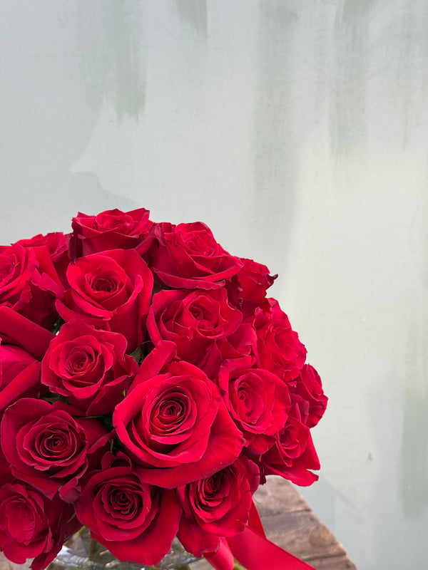About Time (Luxurious and elegant - this head to head red rose bouquet is classic and timeless)