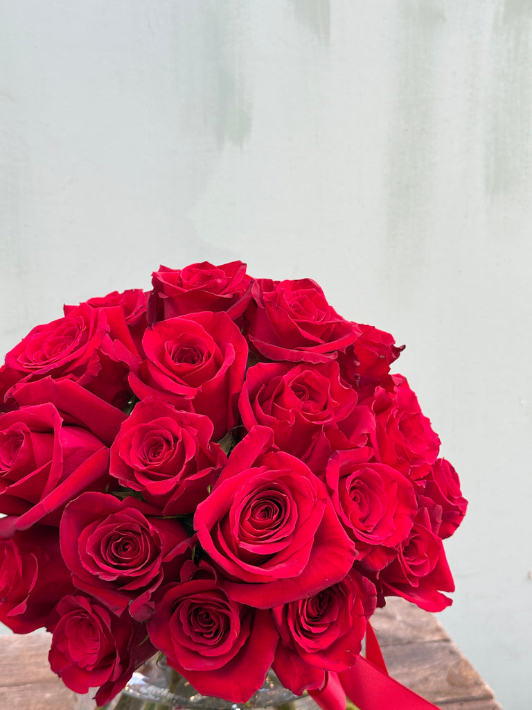 About Time (Luxurious and elegant - this head to head red rose bouquet is classic and timeless)