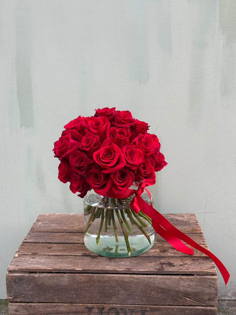 About Time (Luxurious and elegant - this head to head red rose bouquet is classic and timeless)